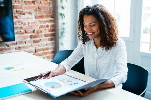 Young business woman reviewing financials