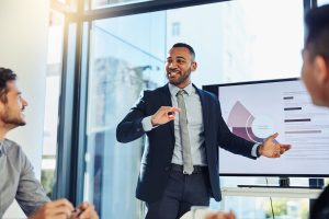 Young professional presenting financial data