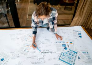 Young woman working on a business plan