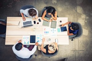 Group of workers going over analytics and data